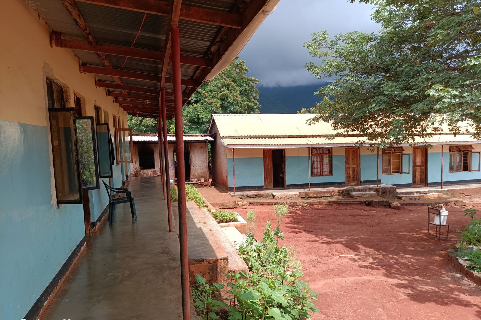 The campus courtyard, with classroom blocks on two sides and planted beds in the middle