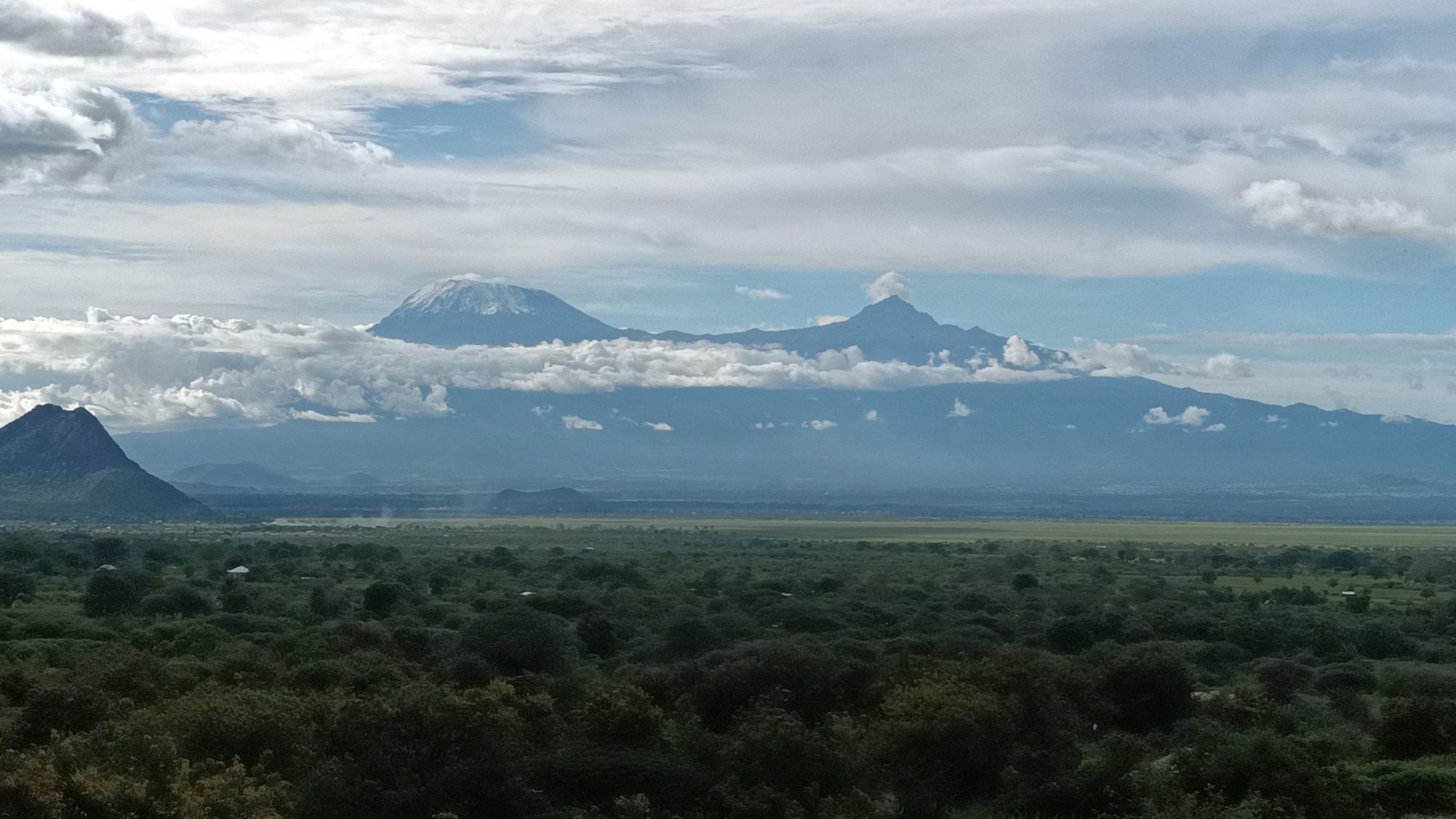 Mount Kilimanjaro and Mawenzi rising above the plain, seen from the ridge above the school